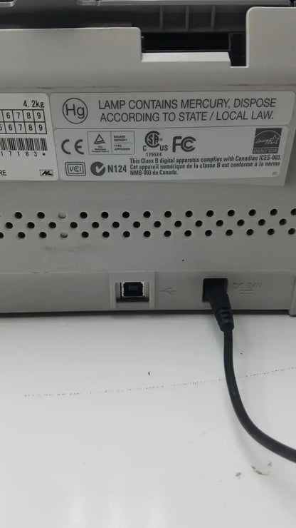White plastic back panel of fujitsu fi-6130z high-speed duplex document scanner with usb port and regulatory labels