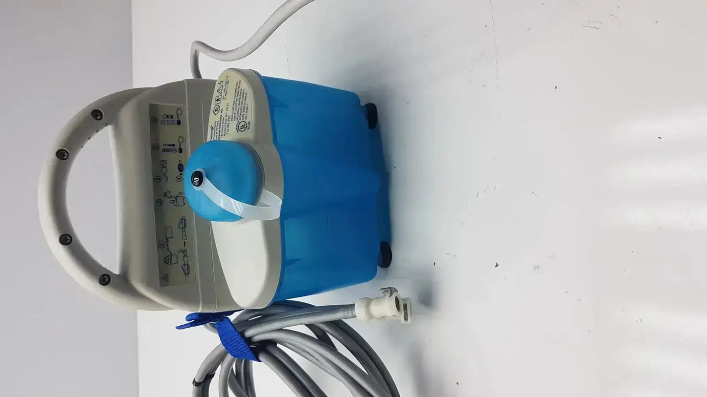 Gaymar Tpump professional heat therapy pump in blue and gray with handle control panel and coiled hose for heat therapy