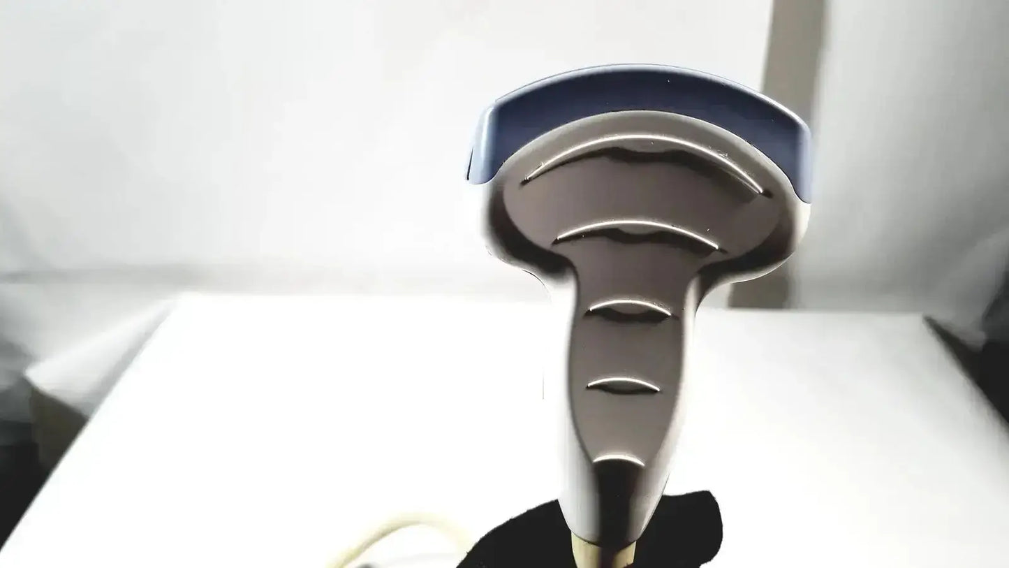 Silver and blue handheld steam iron with sleek ergonomic design shown alongside ge 4c convex array ultrasound transducer probe