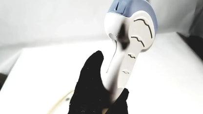 White and blue handheld hair dryer with stylized face design resembling convex array ultrasound transducer probe