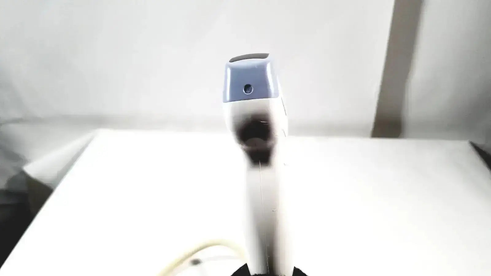 White and gray robotic arm with black circular sensor tip for ge 4c convex array ultrasound transducer probe 2401359