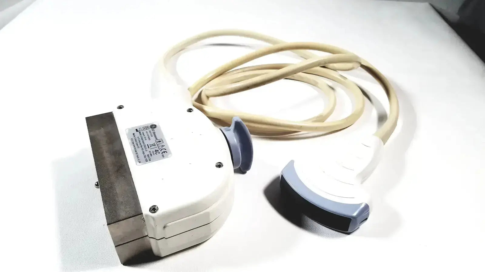White and gray GE 4C convex array ultrasound transducer probe with beige cable for advanced ultrasound systems use