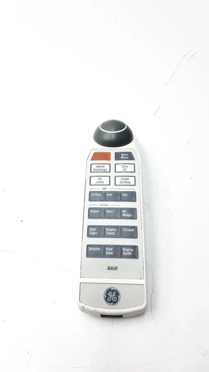 White ge adult solar 8000m 8000i remote control with black and orange buttons and circular knob at top