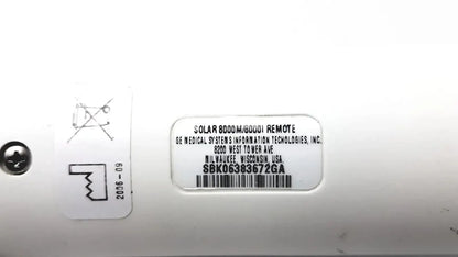 White plastic label on the back of a ge adult solar 8000m 8000i remote control showing model details