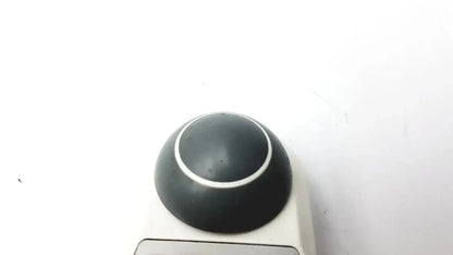 Black spherical trackball with white ring accent on beige base for adult solar 8000m 8000i remote control device