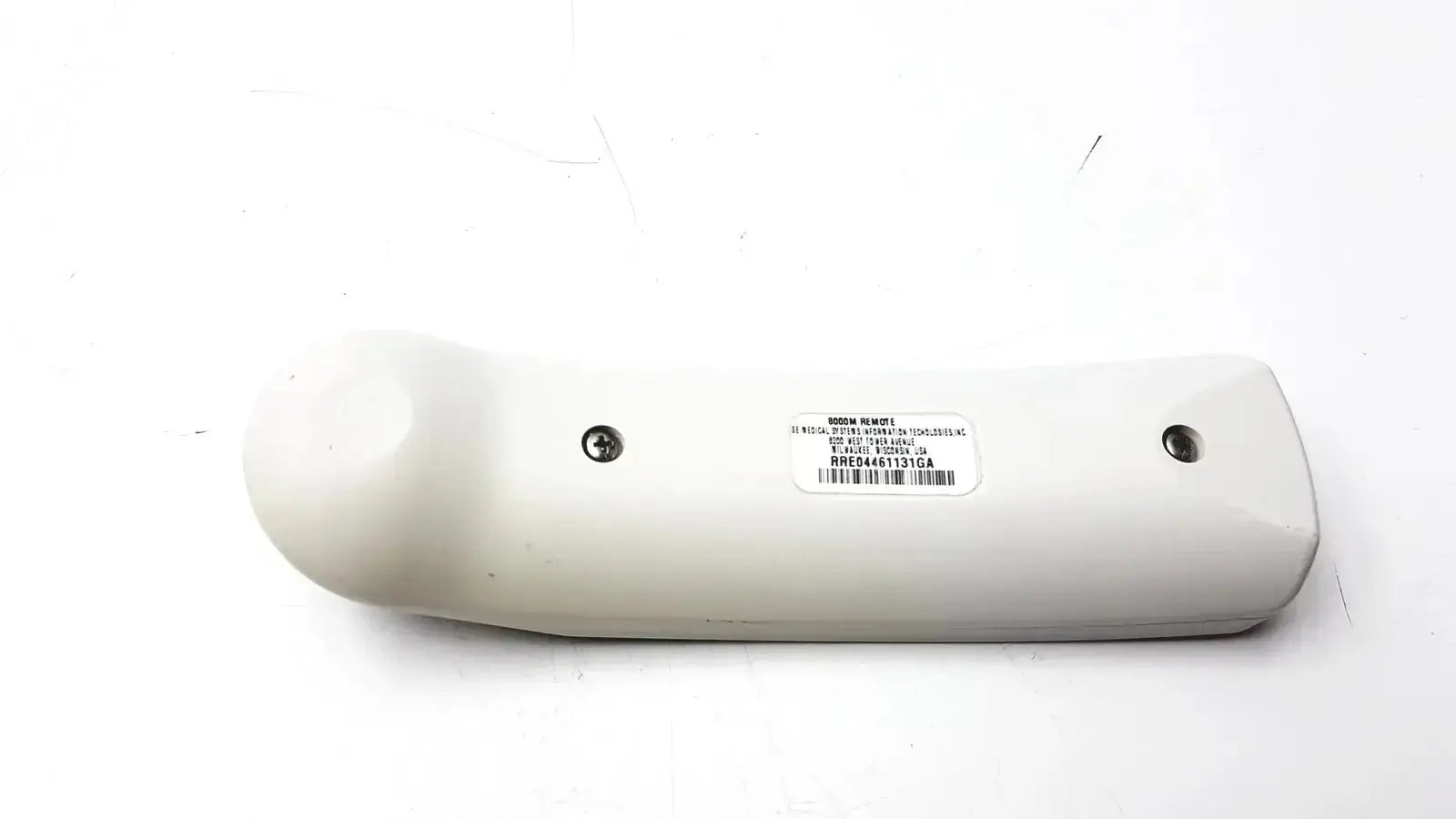 White plastic car door handle cover with two screw holes and barcode label for ge adult solar 8000m remote control back side