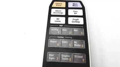 Black plastic remote control for ge adult solar 8000m with labeled medical function buttons for cardiac monitoring