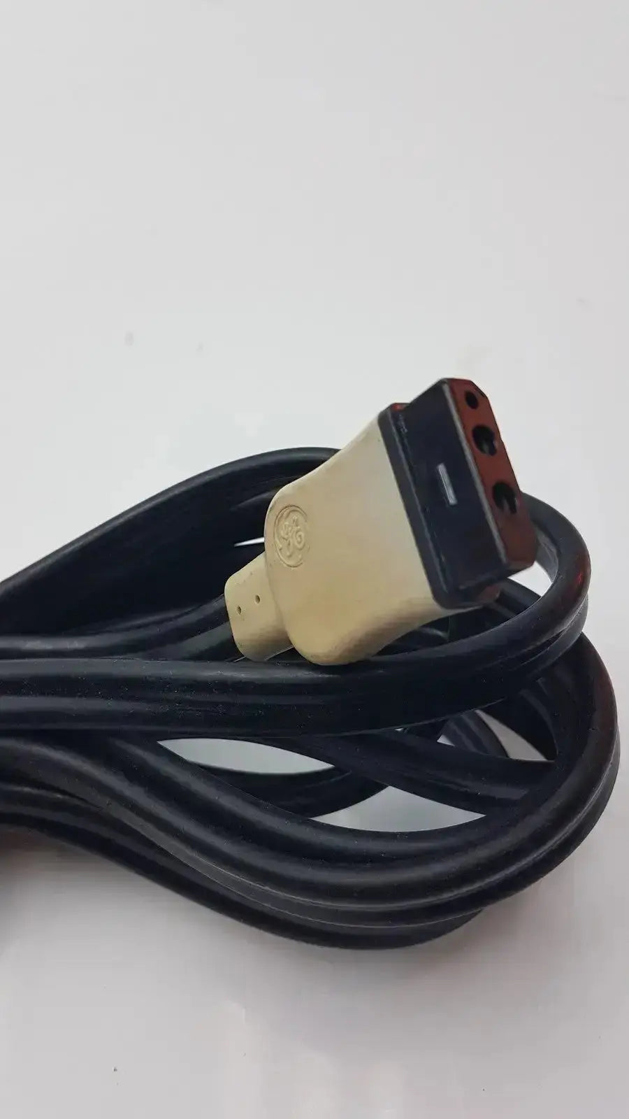 Black GE cable with beige and black three-prong GE plug designed for hospital surplus medical equipment use