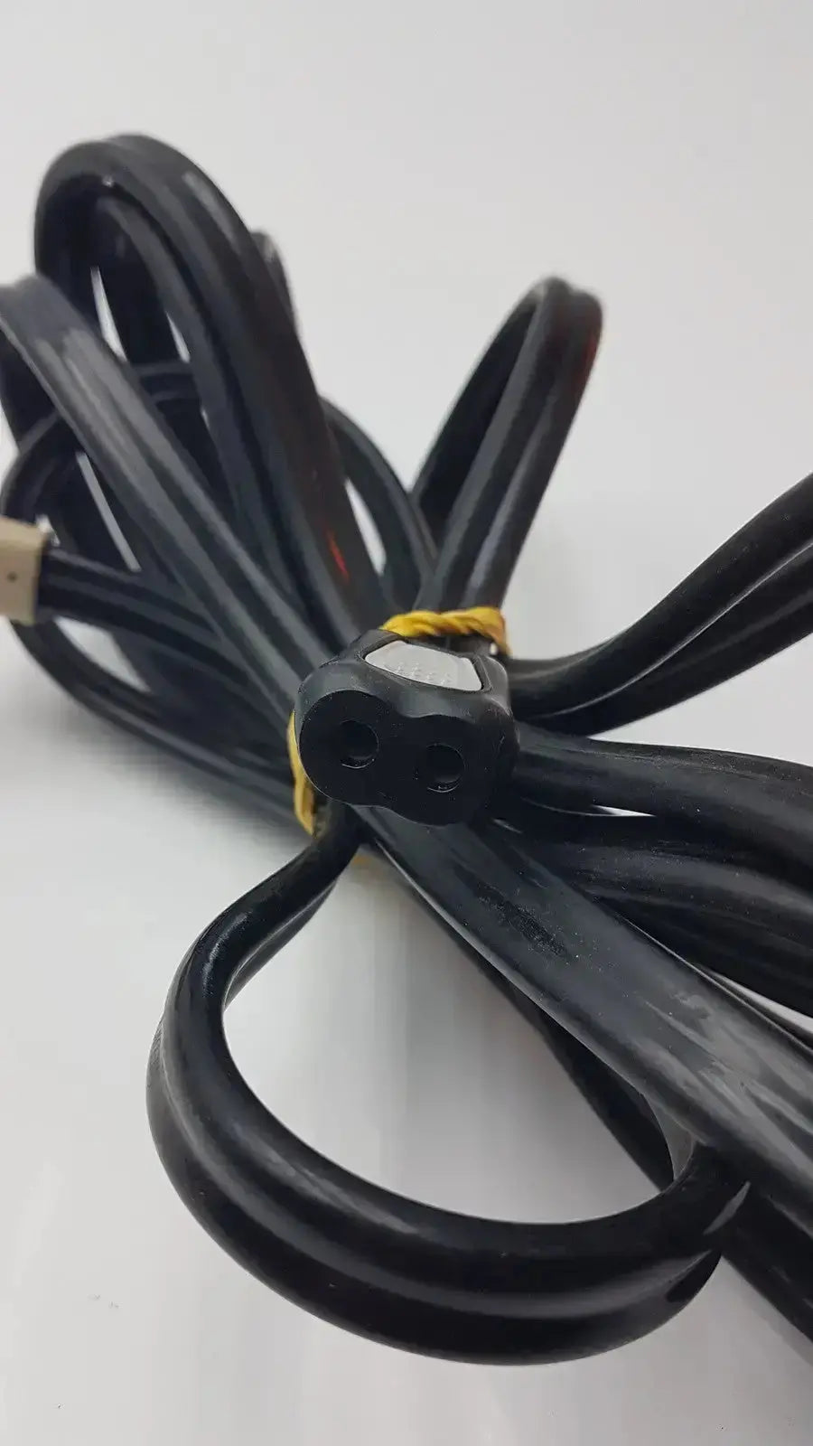 Ge cable black coiled power cord with two-prong plug and yellow tie for hospital surplus medical equipment use