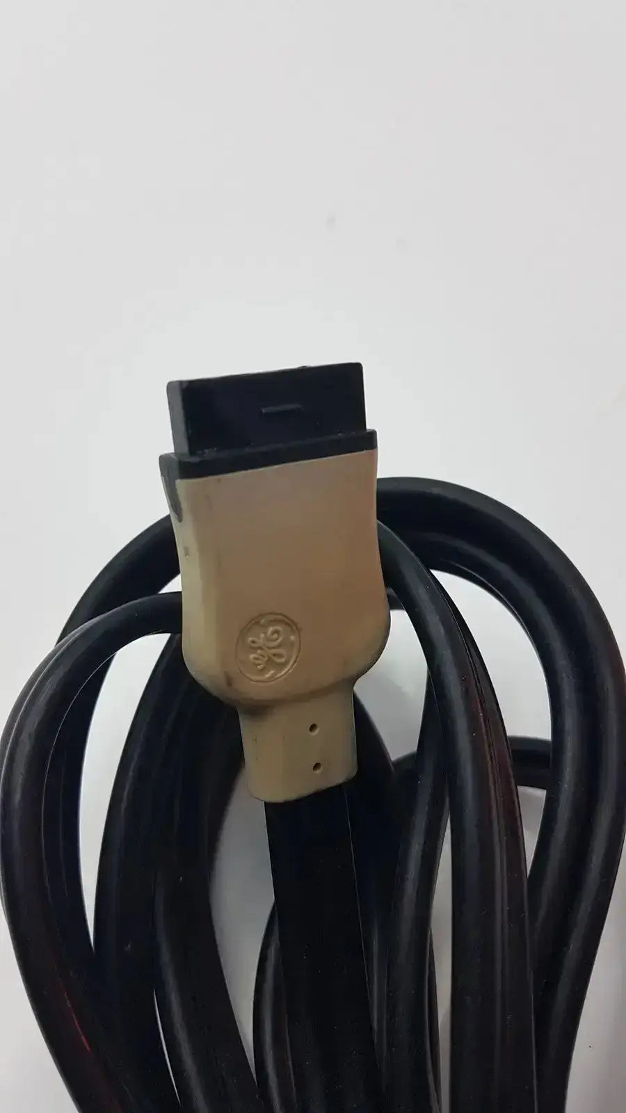 Black GE brand hospital surplus medical equipment HDMI cable with beige connector housing for medical equipment use