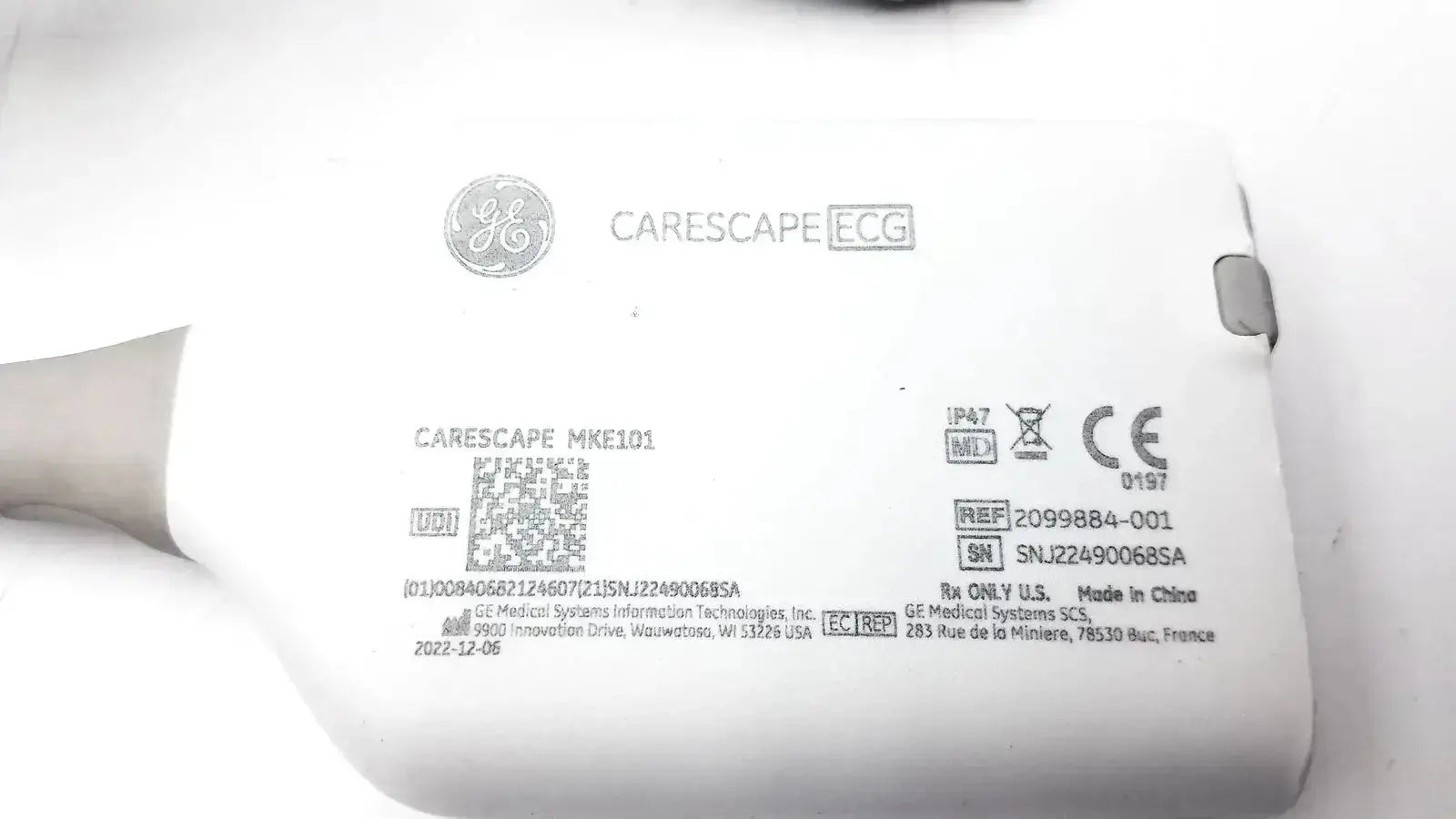 White ge carescape ecg parameter cable with micro module and printed model and regulatory labels visible on device