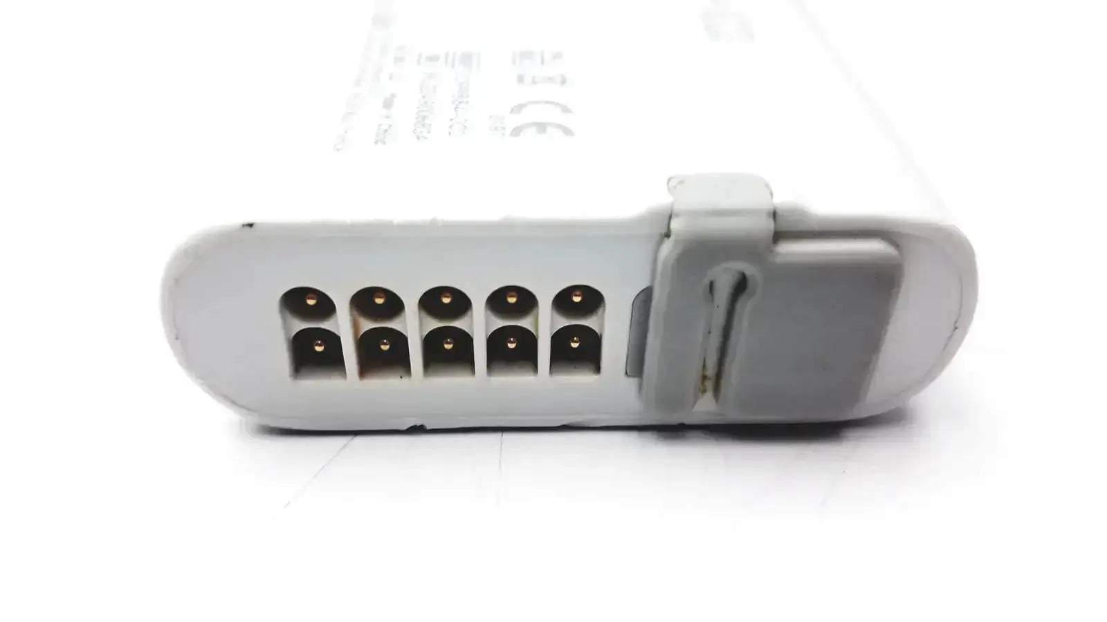 White plastic laptop battery with gray latch and gold contact pins for carescape ecg parameter cable micro module use