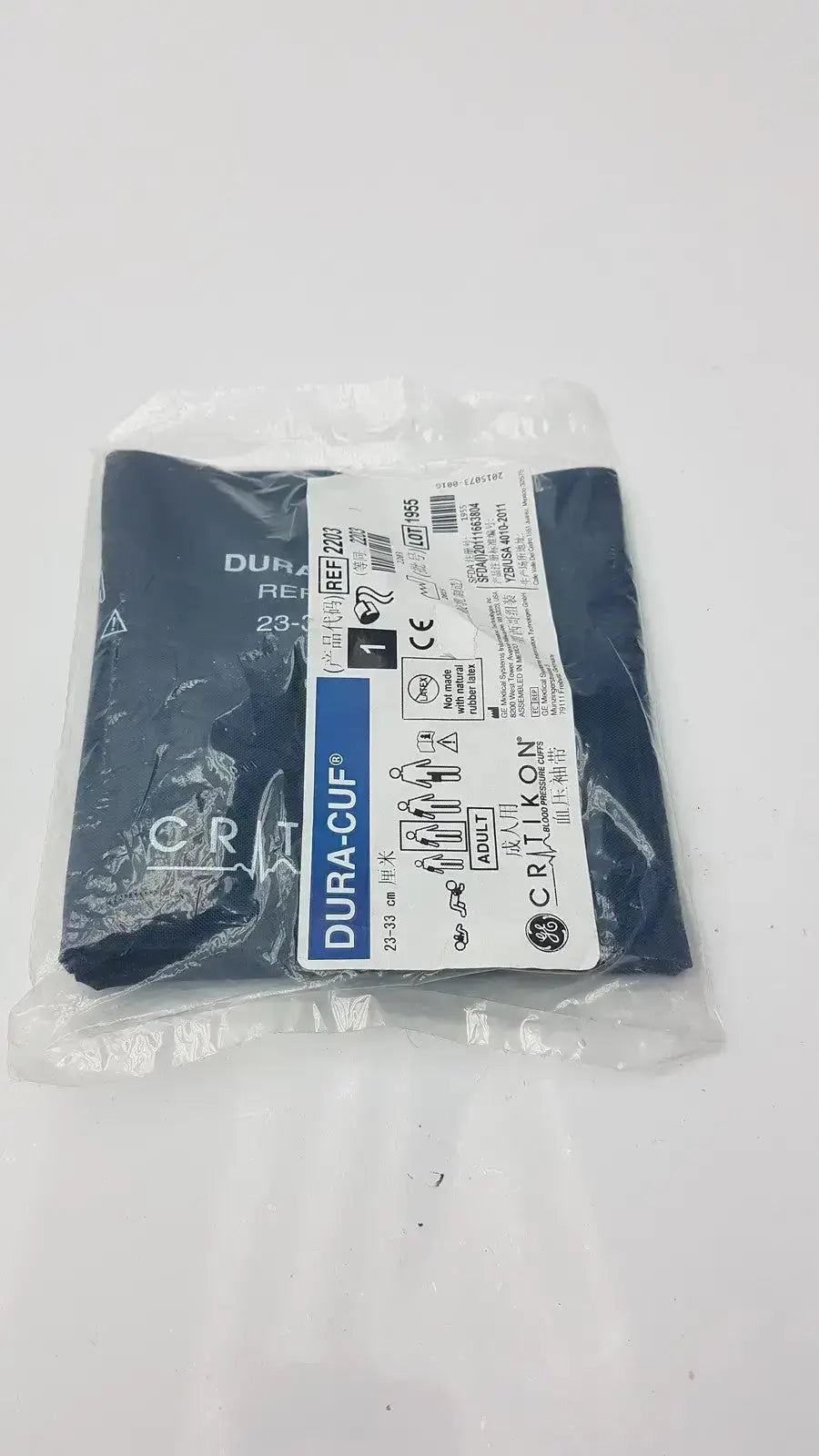 Dark blue ge healthcare duracuf 2203 adult blood pressure cuff in clear plastic packaging for accurate pressure measurement