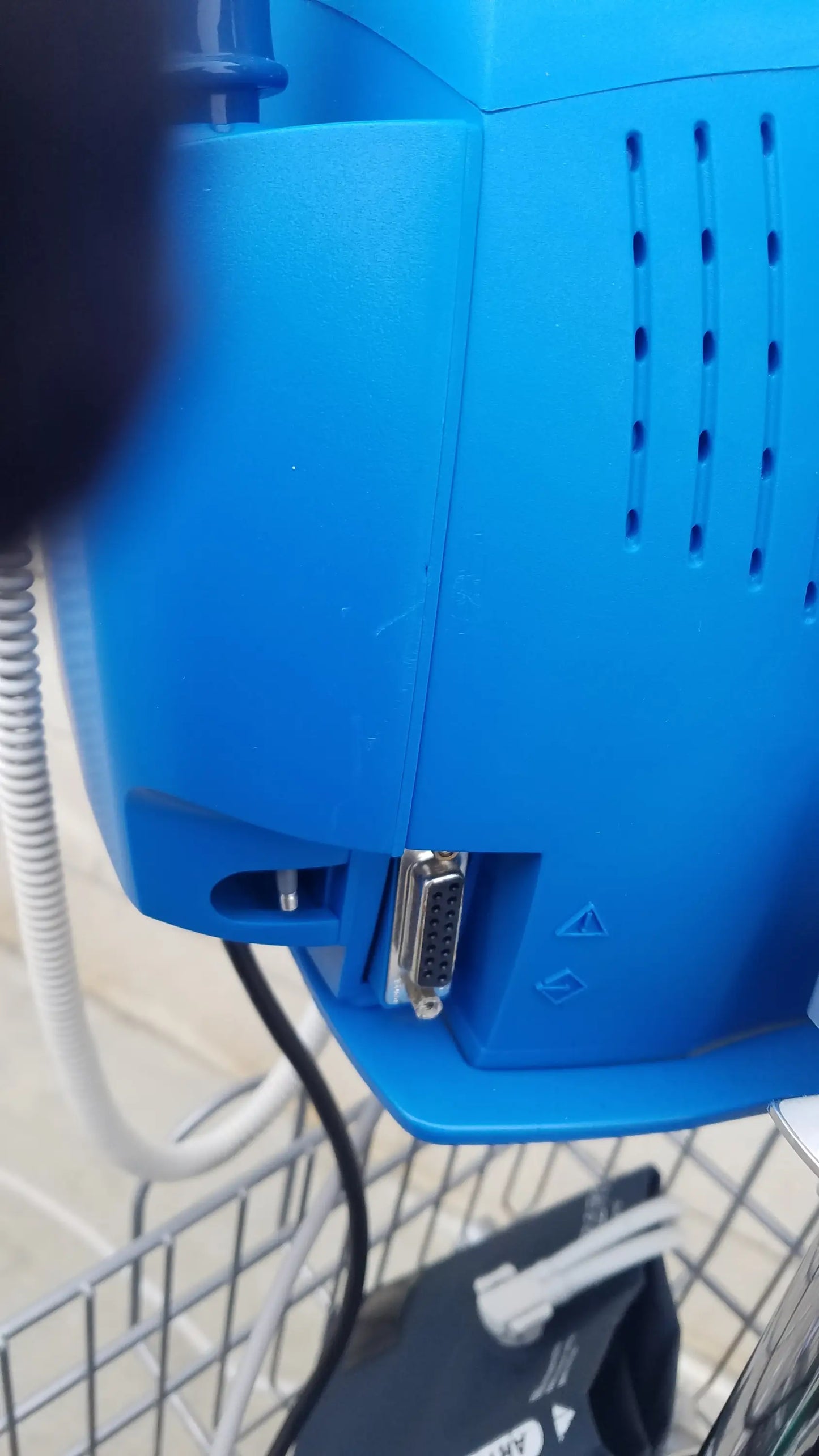 Blue plastic back side of dinamap procare dpc 400 vital signs monitor with d-sub connector ventilation slots medical equipment