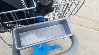 Gray plastic shopping cart tray with shallow rectangular shape and raised edges for reuse medical equipment in dinamap procare dpc