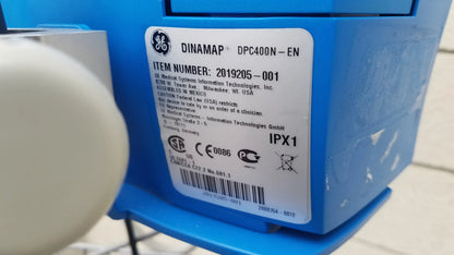 Blue dinamap procare dpc 400n-en medical equipment back with white label showing technical specs and certification marks