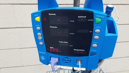 Blue GE Dinamap ProCare DPC 400 vital signs monitor medical equipment with digital display and multiple control buttons for reuse medical equipment