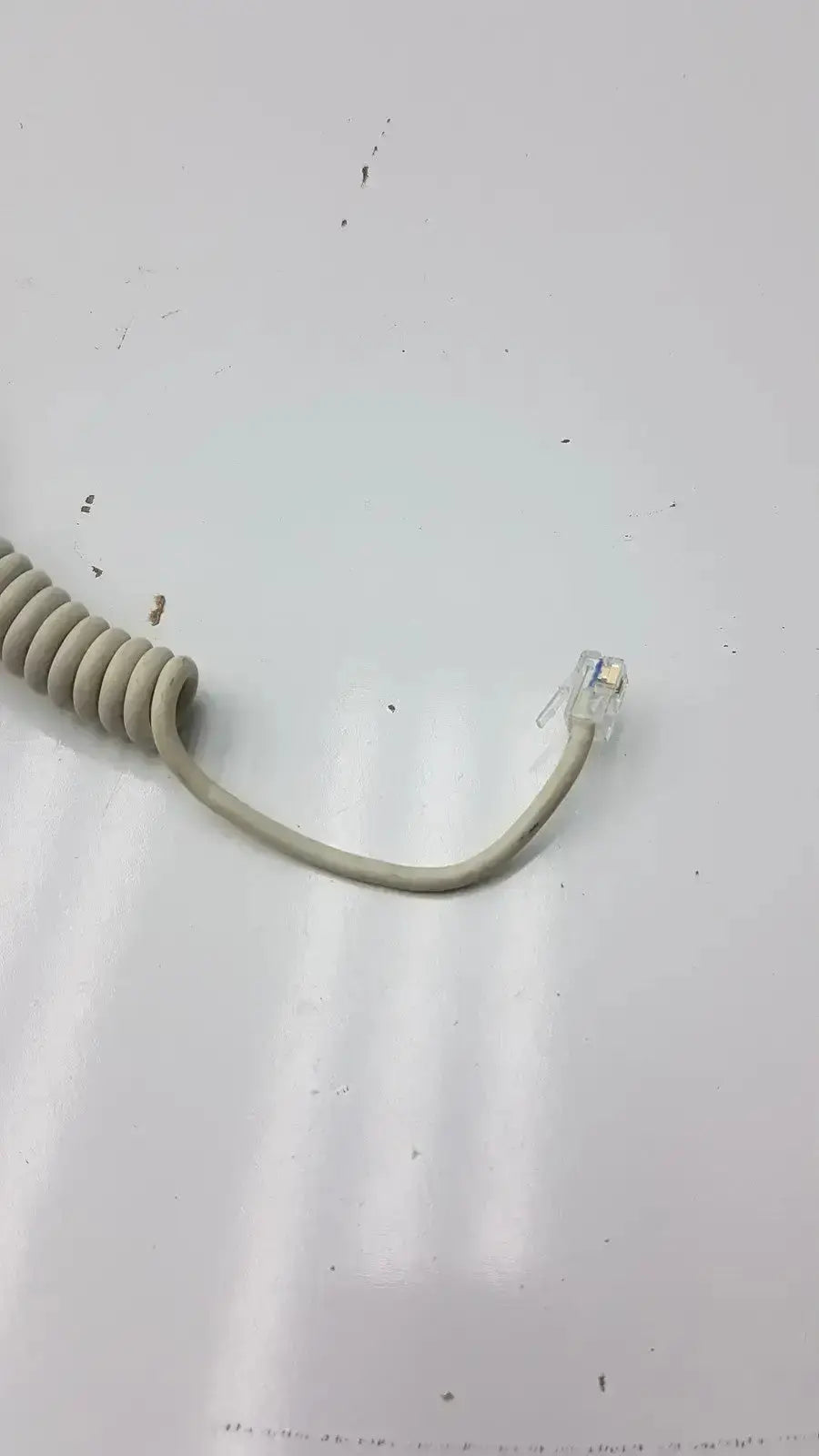 Beige coiled telephone cord with clear rj-45 connector for ge dragonfly hand switch with light spring features