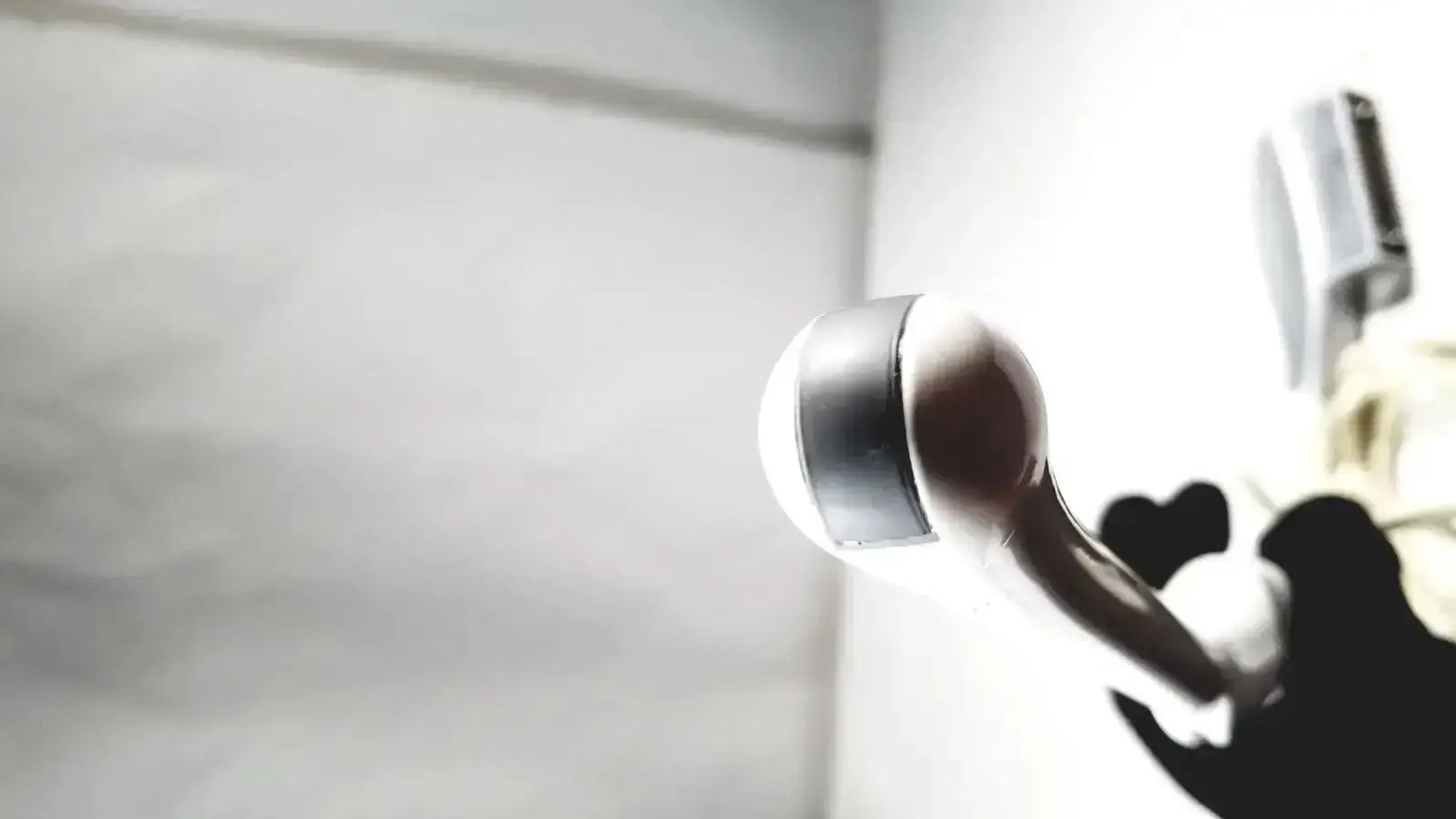 A sleek metallic probe transducer endo with polished chrome finish and rounded nozzle for ultrasound probe use