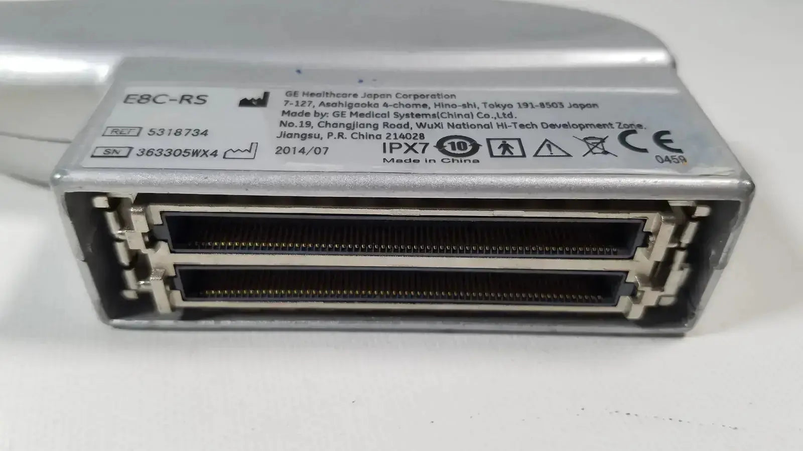 Silver metallic ge healthcare e8c-rs endovaginal ultrasound probe with two black connectors shown from the back side