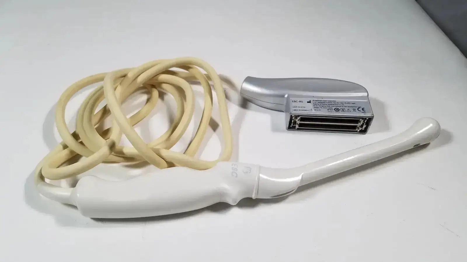White and silver GE e8c-rs endovaginal ultrasound probe with beige cable designed for endovaginal ultrasound use
