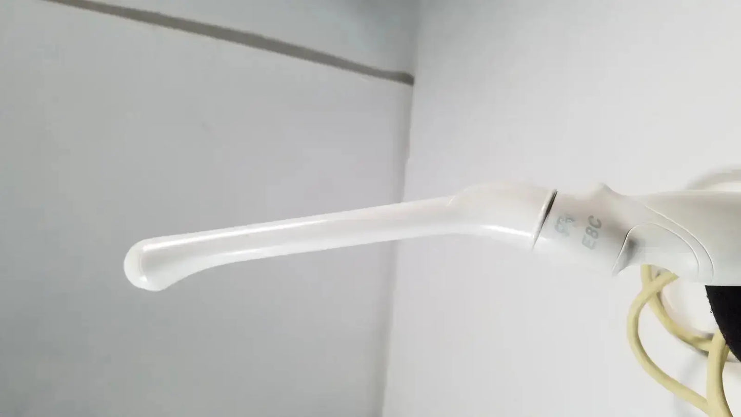 White plastic dental irrigation tip with curved nozzle and textured grip for ge e8c-rs endovaginal ultrasound probe