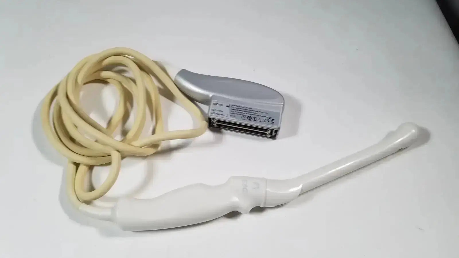 Silver and white GE E8C-RS endovaginal ultrasound probe transducer with beige cable for endovaginal ultrasound use