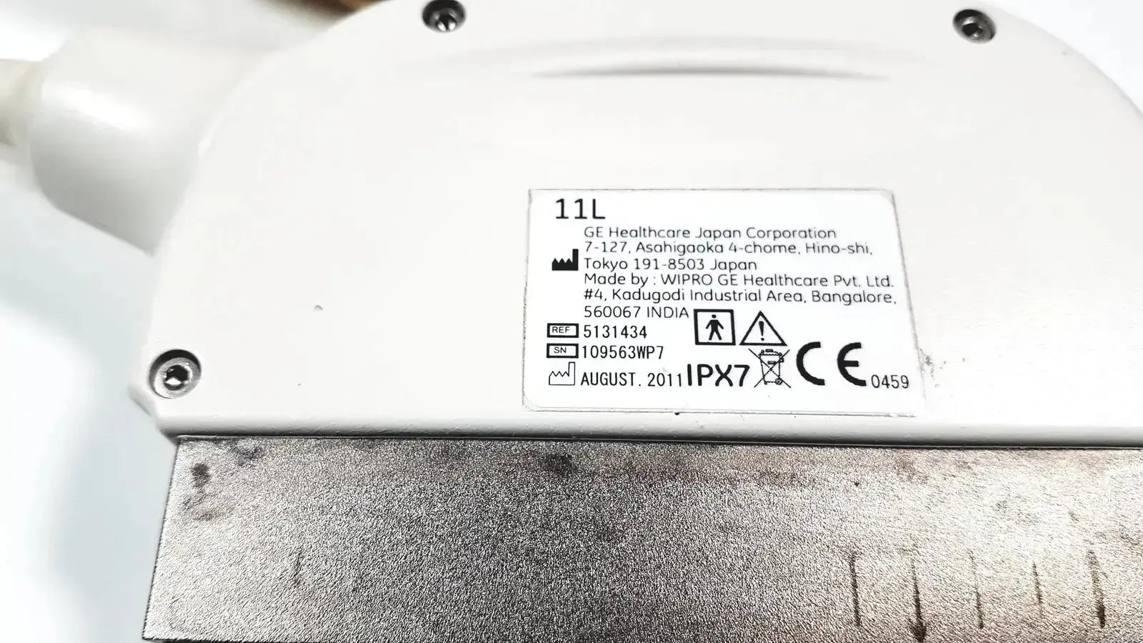 White plastic ge healthcare 11l linear array ultrasound transducer probe with metal base and manufacturer label