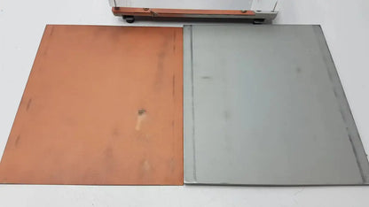 Two rectangular metal sheets copper and silver colored in GE Healthcare cardiovascular phantom for buy used medical equipment