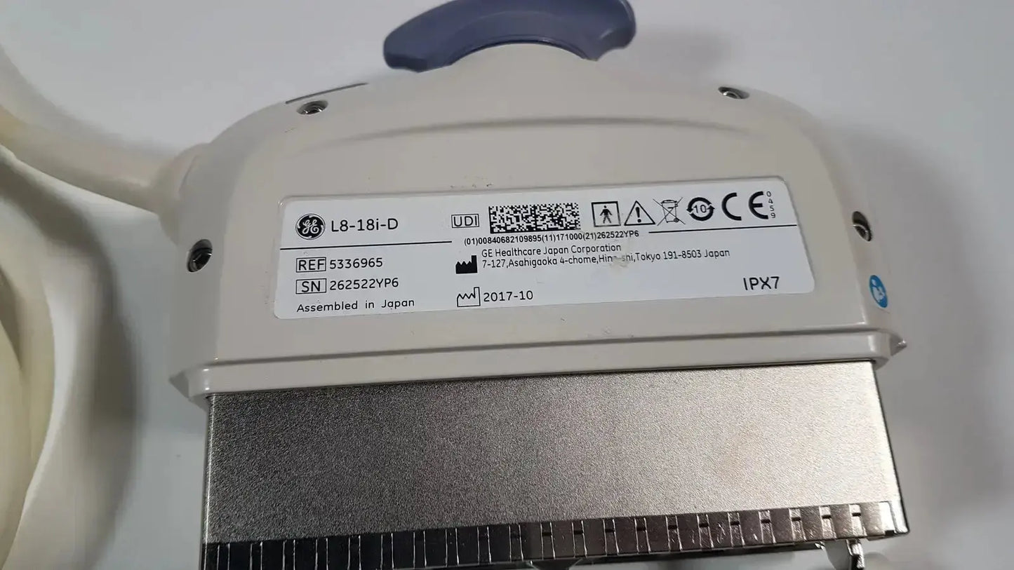 Beige ge l8-18i-d linear array ultrasound transducer with silver metallic connector and blue handle for array ultrasound use