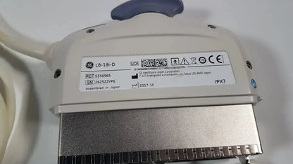 Beige ge l8-18i-d linear array ultrasound transducer with silver metallic connector and blue handle for array ultrasound use