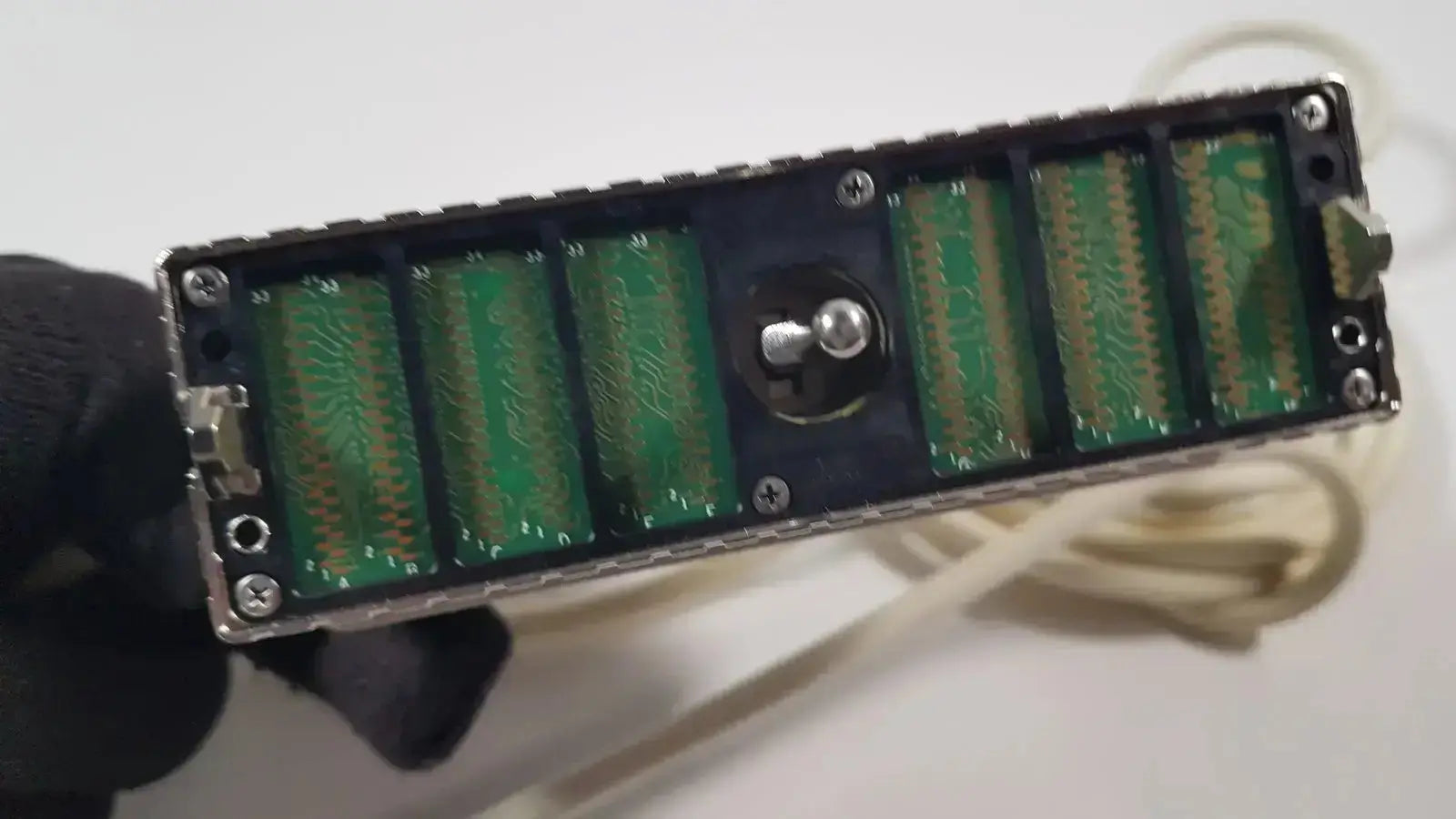 Black rectangular GE L8-18i-D linear array ultrasound device with six green circuit boards and central metallic component