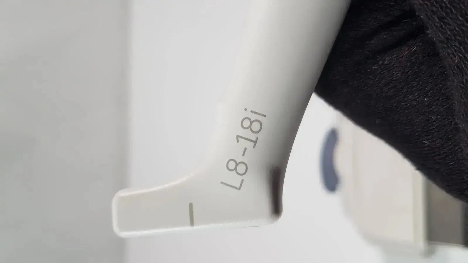 White plastic syringe with engraved model number l8-18i on barrel for ge l8-18i-d linear array ultrasound use