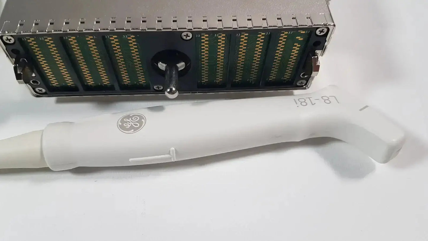 White ge l8-18i-d linear array ultrasound transducer with curved handle and silver logo beside metallic server rack