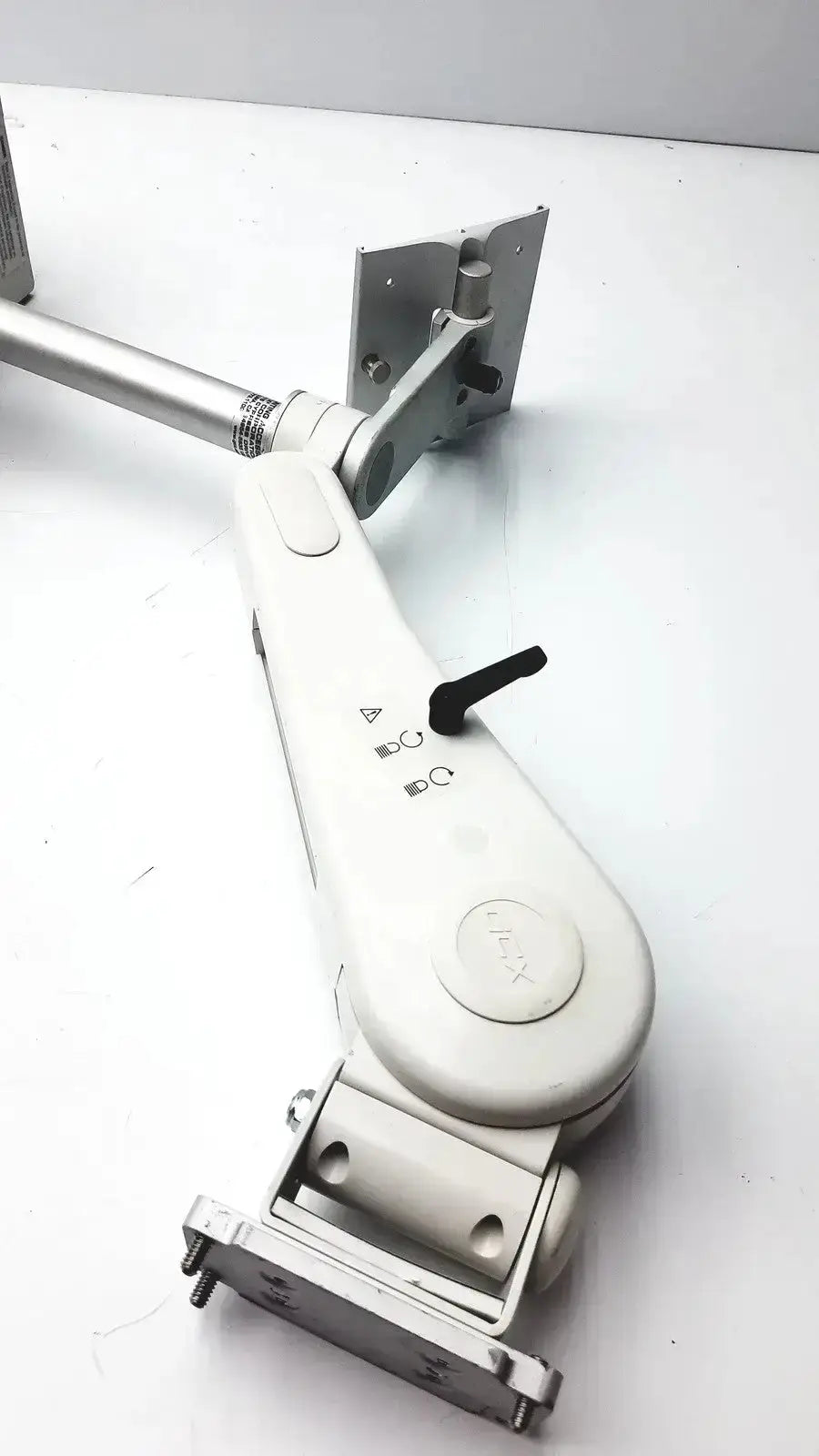 White plastic and metal housing module 250sl with black adjustment knob and gcx monitor mount arm shown from back side