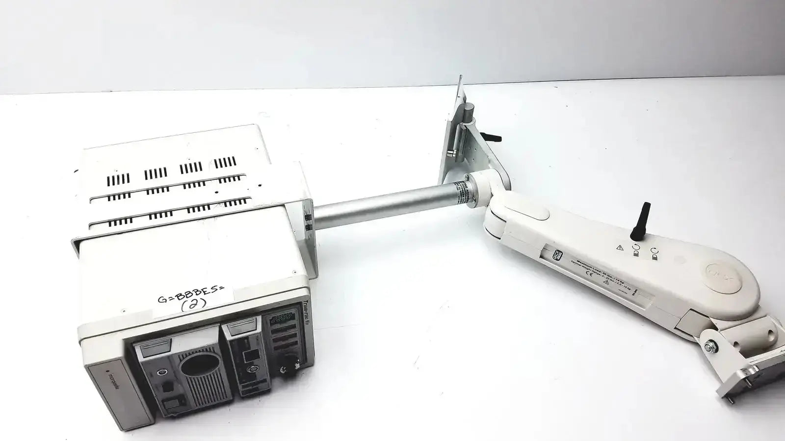 White plastic and metal gcx monitor mount arm with silver pole for ge marquette housing module 250sl