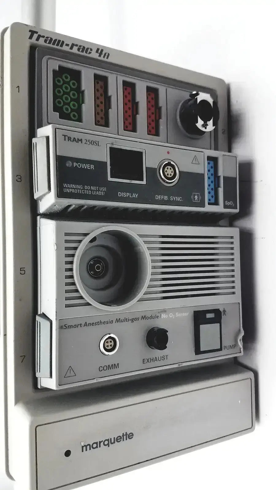 Gray plastic ge marquette tram-rac 4a housing module 250sl with labeled ports and gcx monitor mount arm backside view