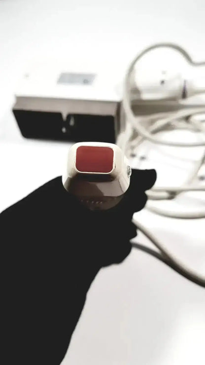 White and red handheld epilator with sleek modern design featured alongside GE medical phased array probe for Logiq and Vivid series