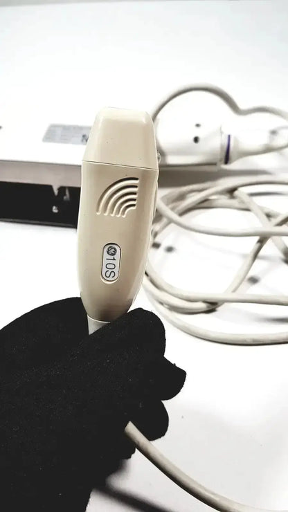 Beige handheld phased array probe with textured grip and sos label for GE medical Logiq and Vivid series ultrasound systems