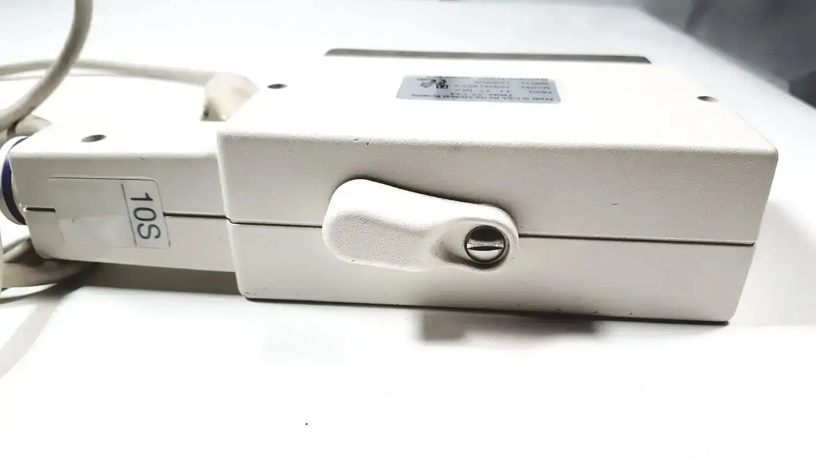 White plastic phased array probe with keyhole labeled 10s for GE medical 2298593 rev 0 phased array device