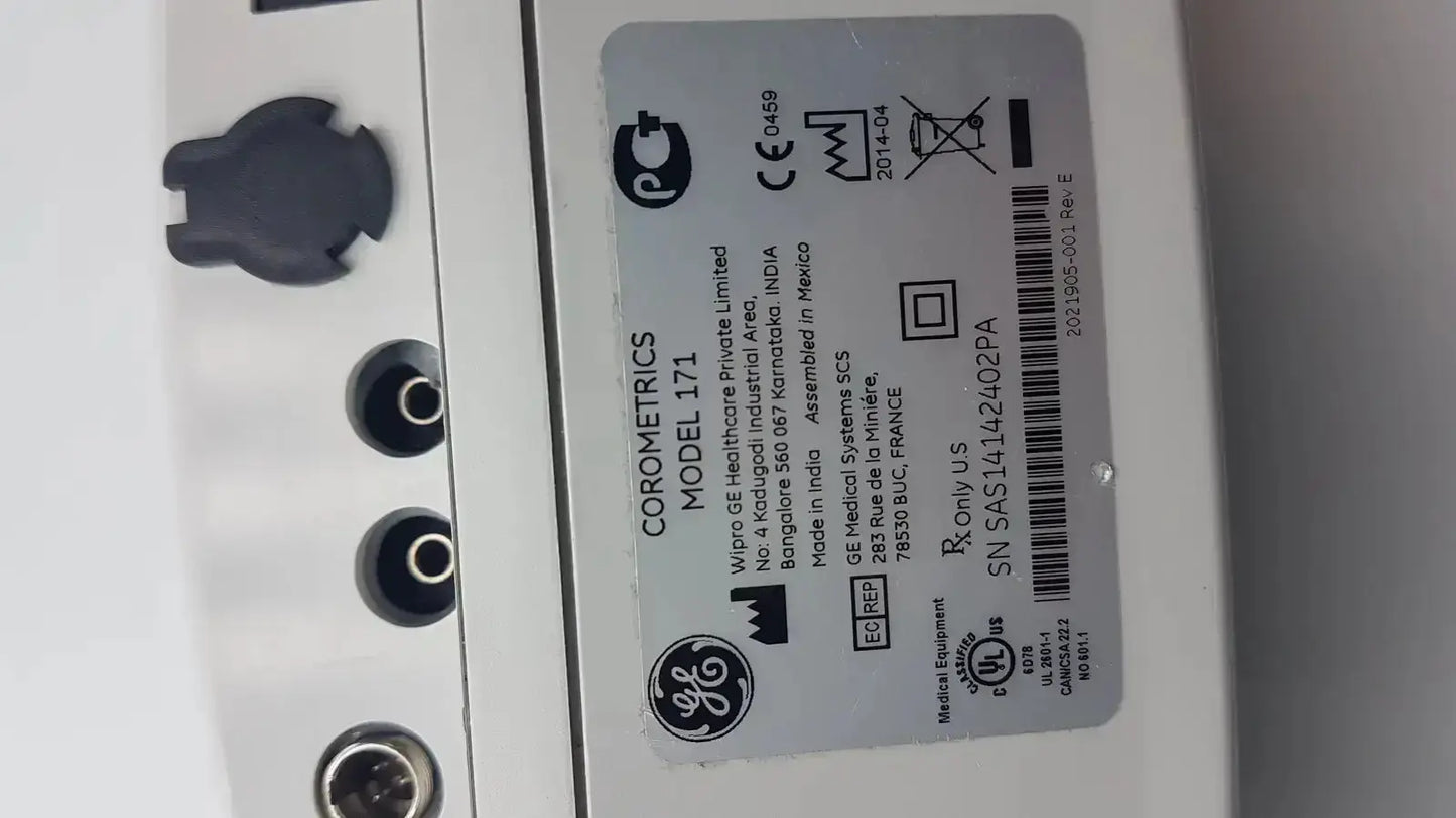 White plastic label with black text and symbols on ge healthcare corometrics 171 external fetal monitor device