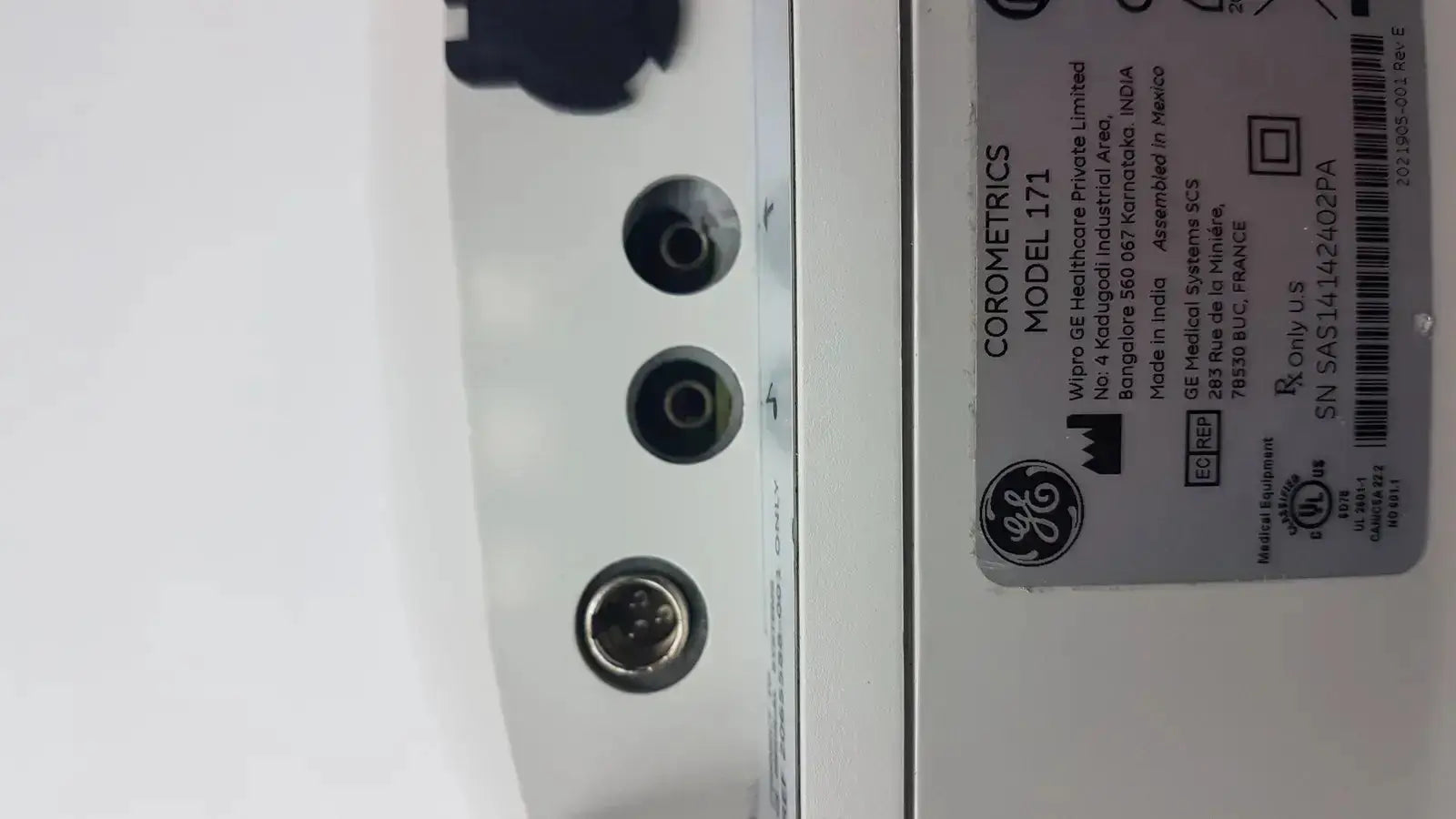 White ge corometrics model 171 external fetal monitor showing three circular ports on the side for medical use
