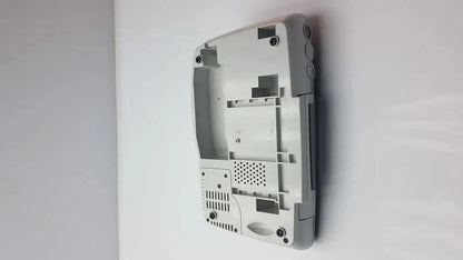 Gray plastic nintendo ds lite console shell showing internal components and ventilation slots of external fetal monitor