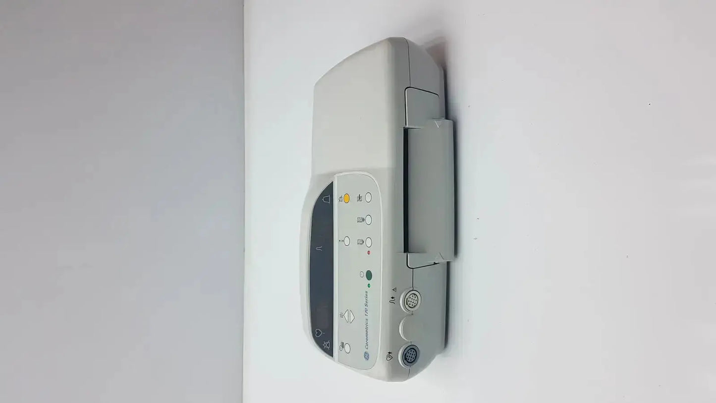 Gray GE Medical Corometrics 170 Series model 171 external fetal monitor with digital display and control buttons mounted on wall
