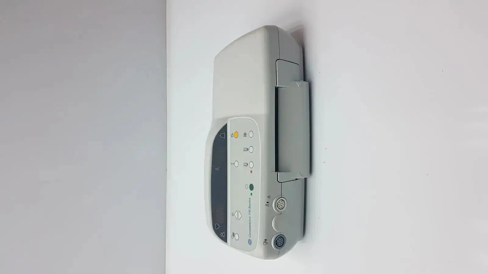 Gray GE Medical Corometrics 170 Series model 171 external fetal monitor with digital display and control buttons mounted on wall