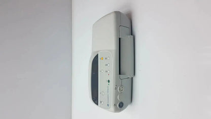 Gray GE Medical Corometrics 170 Series model 171 external fetal monitor with digital display and control buttons mounted on wall