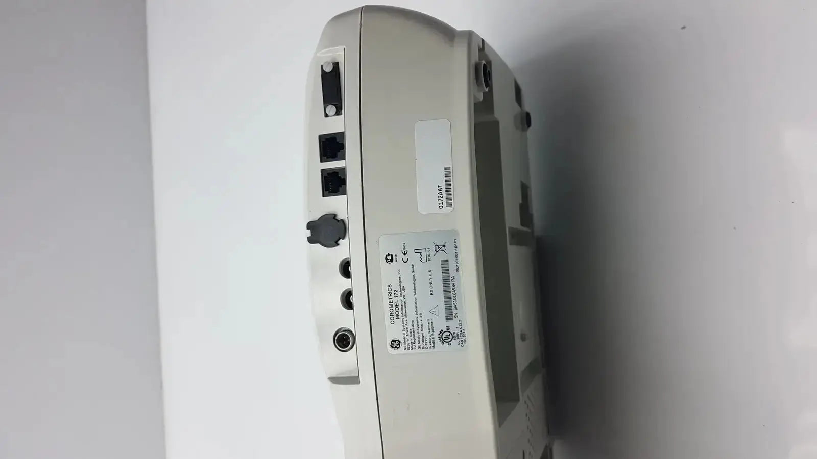 Beige plastic external fetal monitor network switch with multiple ports and technical specifications label, corometrics 170 series model 172