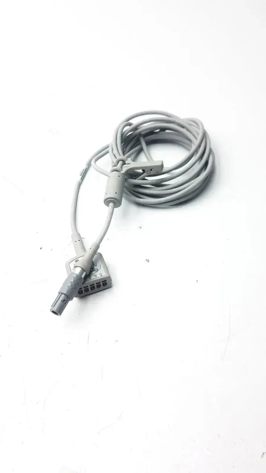 Gray coiled medical ecg trunk cable r2424549 with cylindrical plug and rectangular multi-pin connector for ecg devices