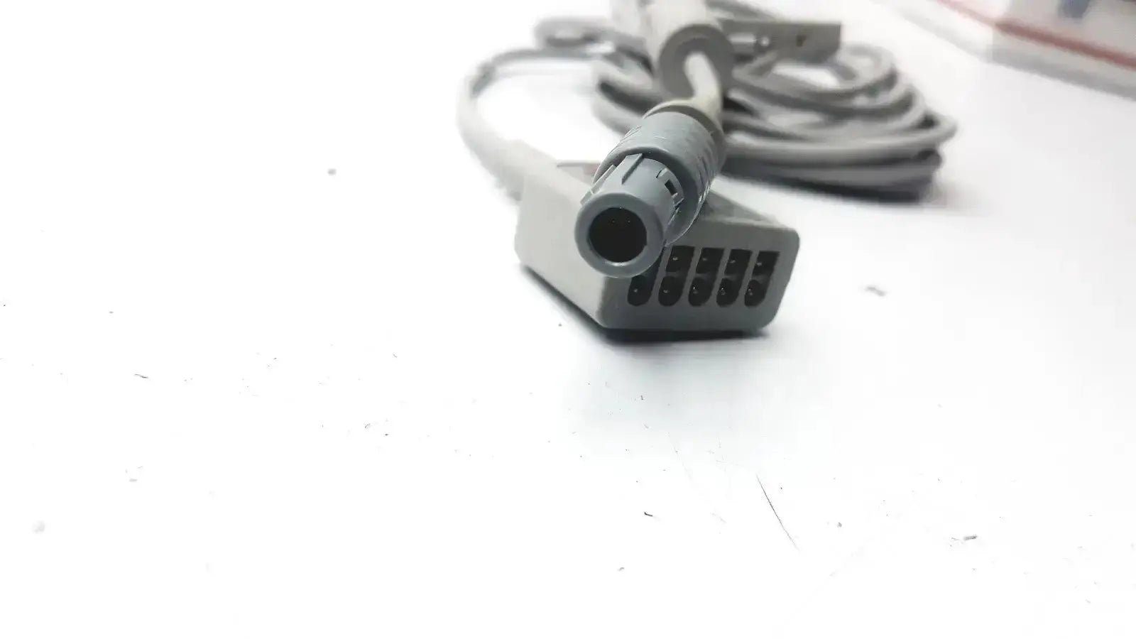 Gray medical-grade GE medical ECG trunk cable with multi-pin connector and rounded housing for reliable trunk cable use