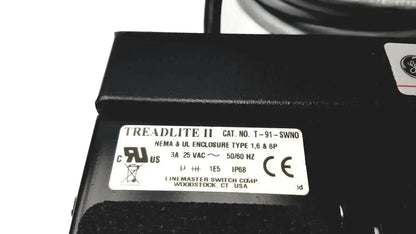 Black treadlite ii industrial electrical enclosure with white technical label on back of ge medical systems footswitch 3-padels ip68